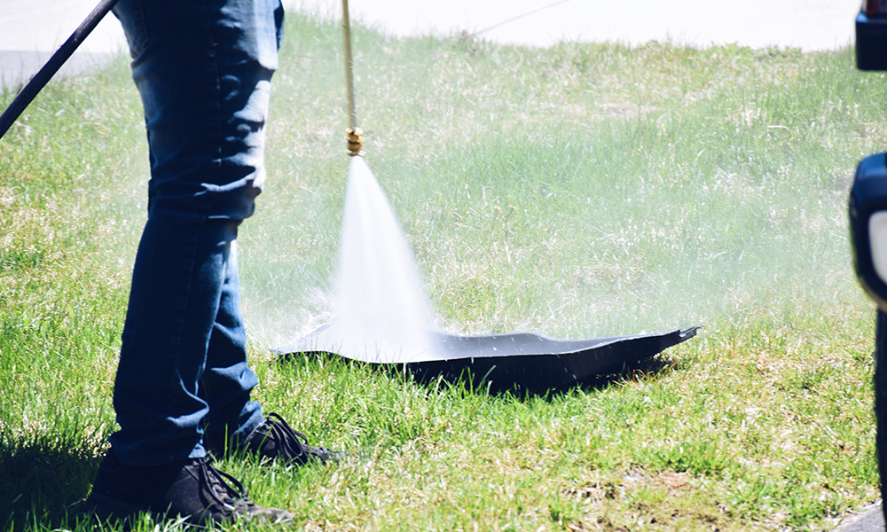 Pressure wash car floor mats